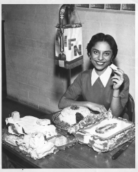Black and white photo of Graciela Gil Olivarez on the air at KIFN radio, 1961